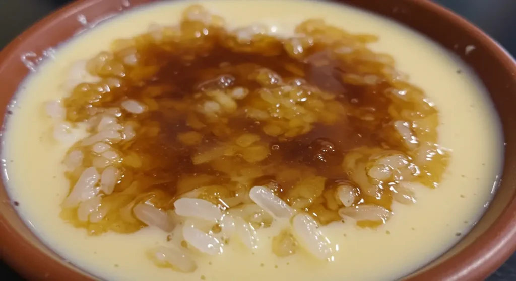 Arroz con leche ingredients including milk, rice, sugar, and cinnamon arranged before cooking